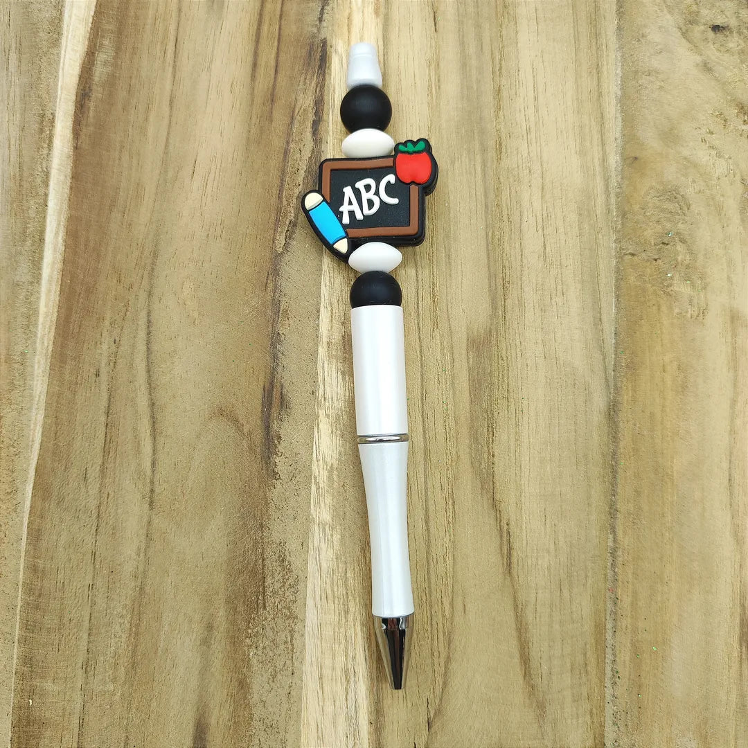 stylo blanc tableau de maitresse