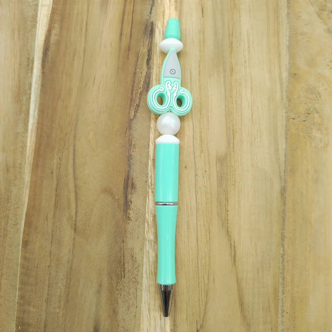 stylo vert ciseau